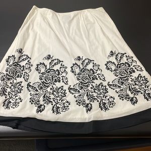 Full skirt falls just below knee. Great for Summer